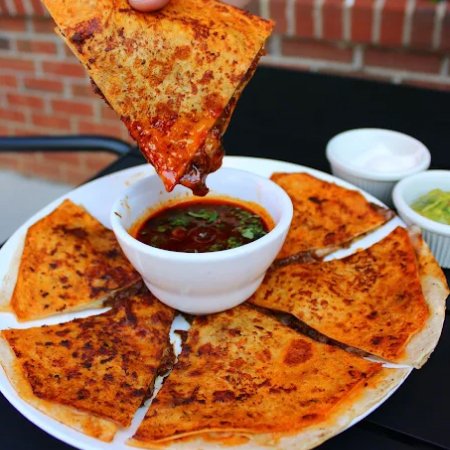 a dish with six perfectly cut quesabirrias